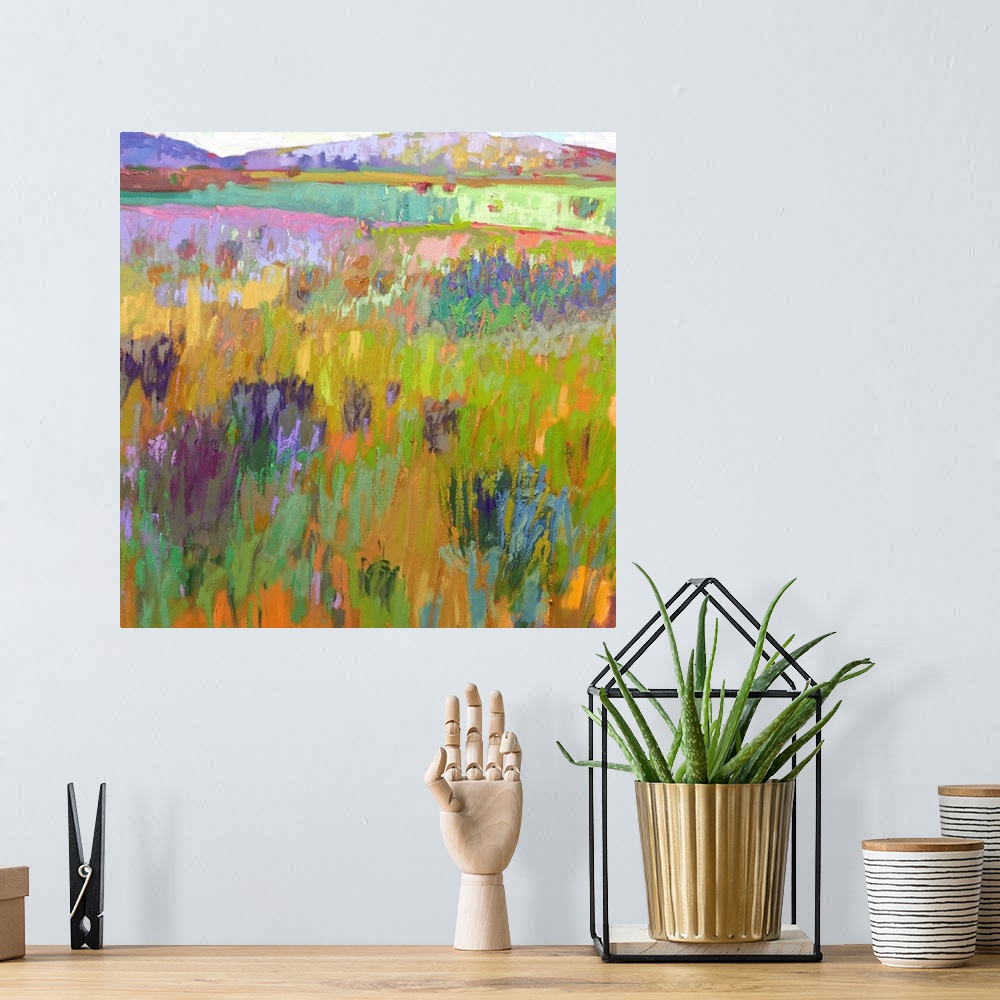 A bohemian room featuring A square abstract of a field with flowers painted with brush strokes of vibrant colors.