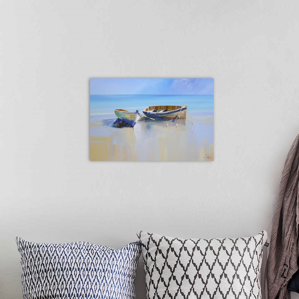 A bohemian room featuring Painting of two beached rowboats at low tide.