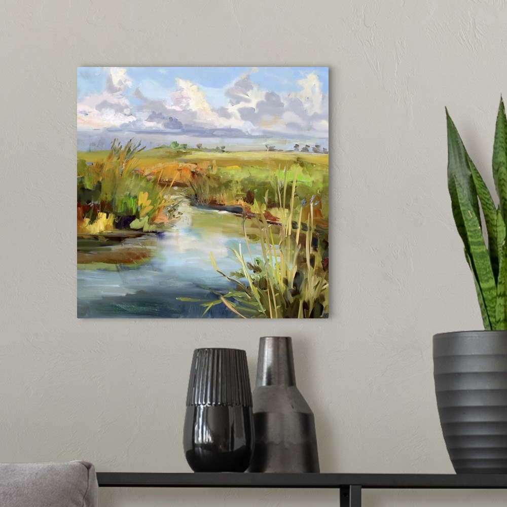 A modern room featuring A contemporary painting of a marshland under a blue sky.