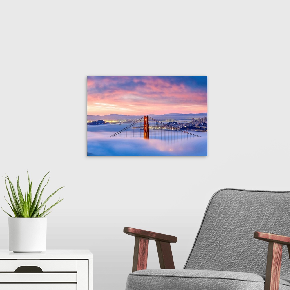 A modern room featuring Aerial view of the Golden Gate Bridge surrounded by fog.