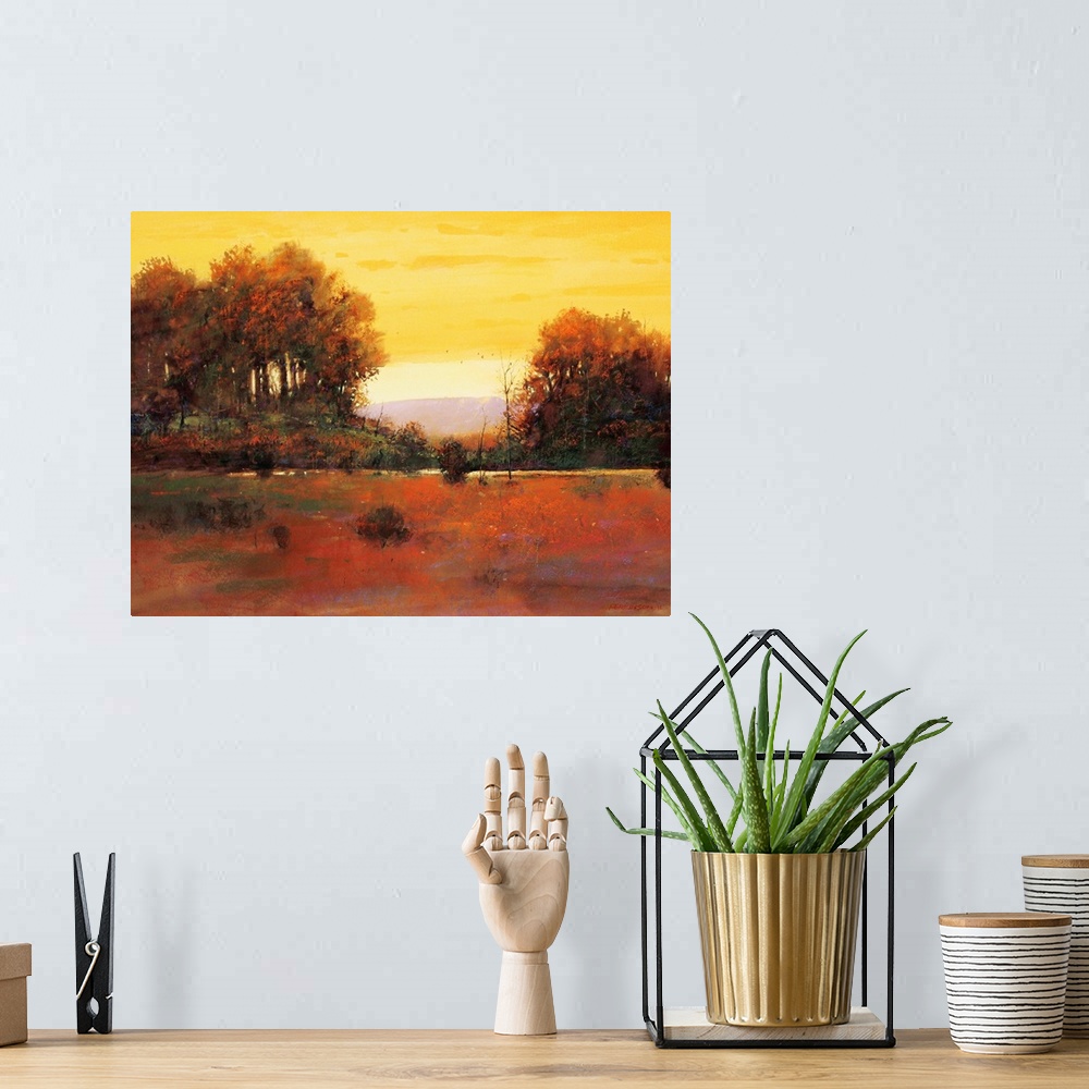 A bohemian room featuring A contemporary painting of a southwestern landscape under an orange sky.