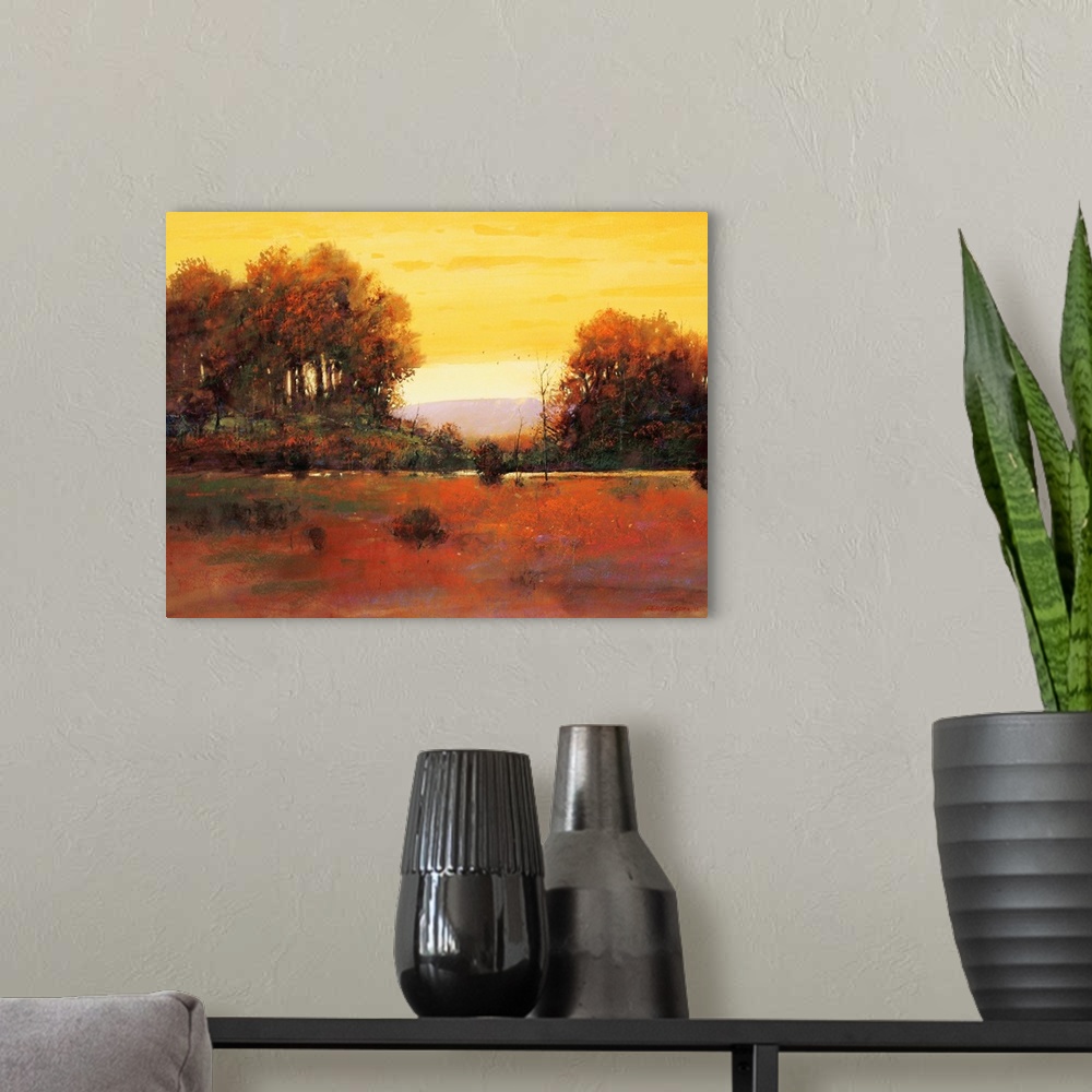 A modern room featuring A contemporary painting of a southwestern landscape under an orange sky.