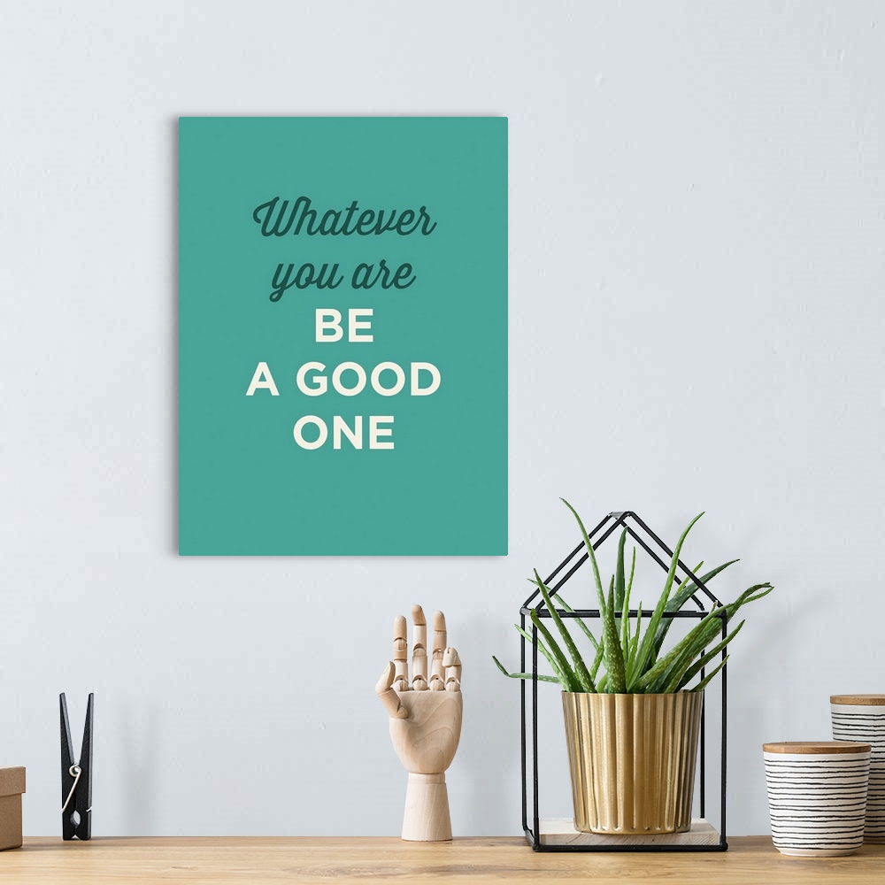 A bohemian room featuring "Whatever You Are Be A Good One" on a teal background.