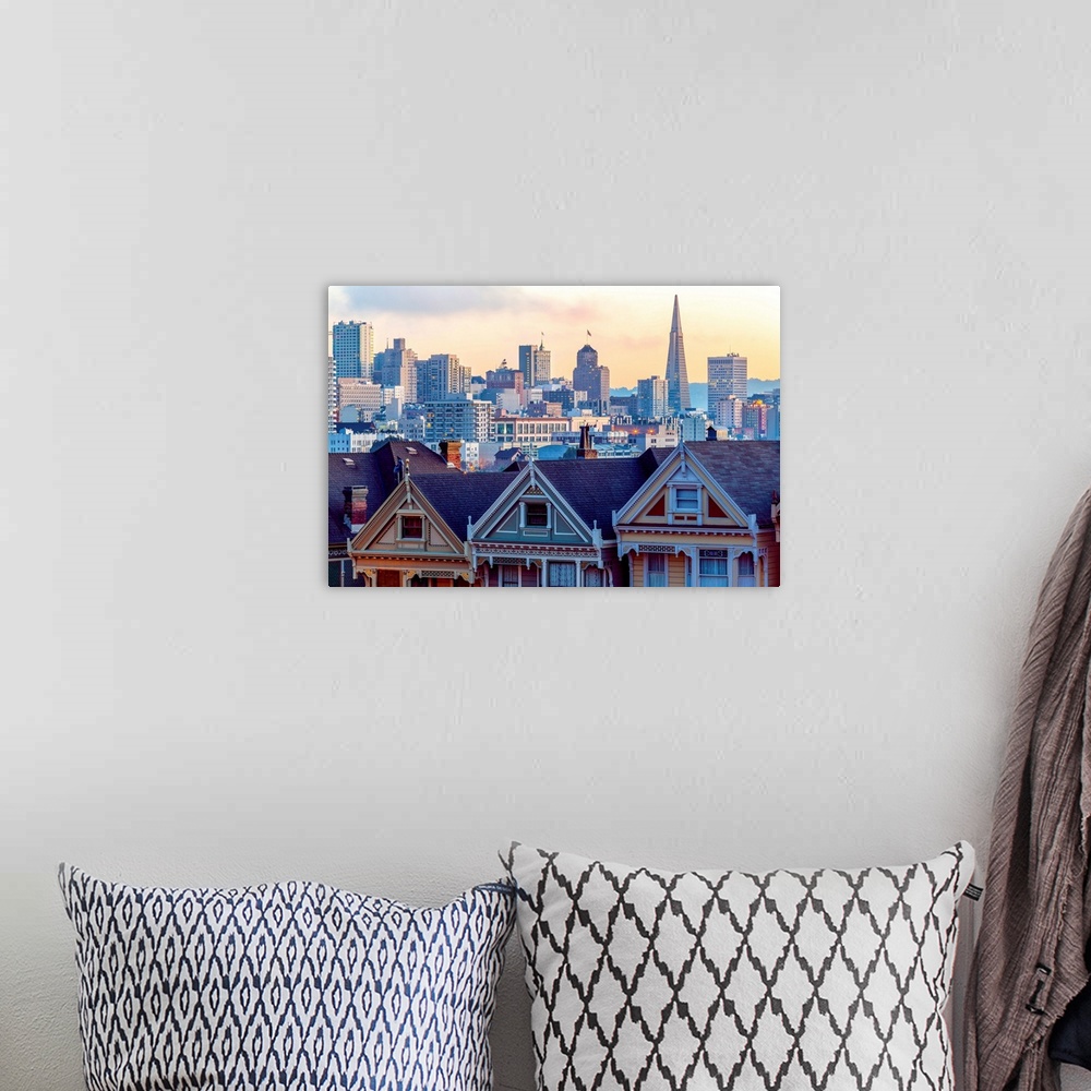 A bohemian room featuring Photography of a pastel-colored row of houses with the San Francisco skyline in the background.
