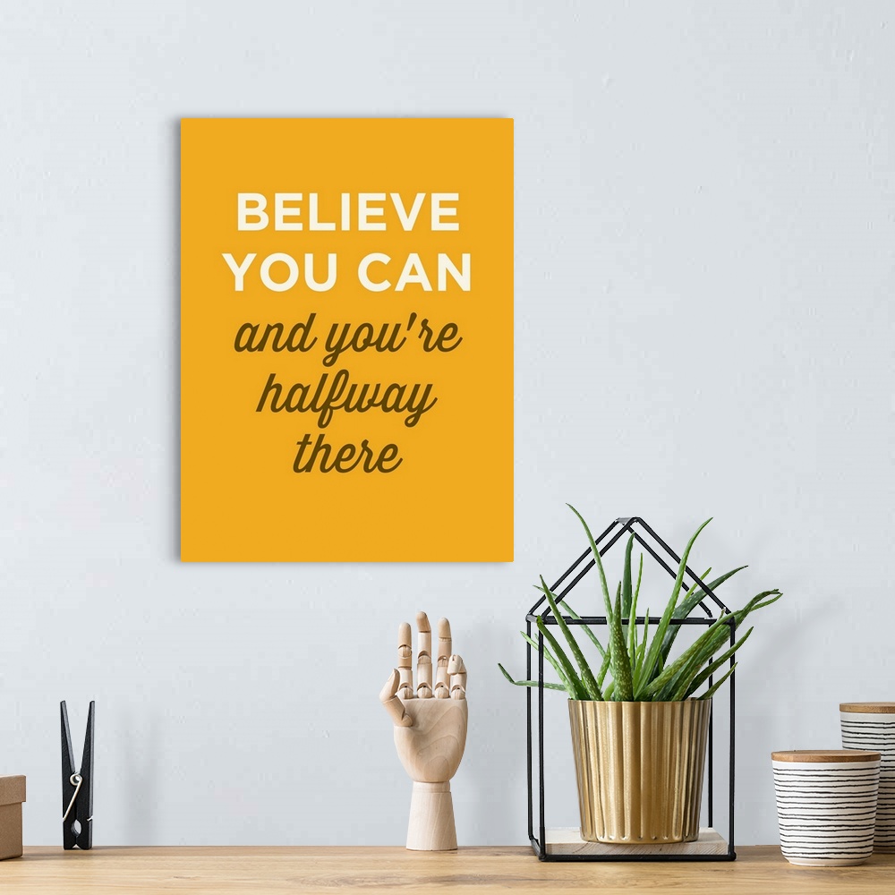 A bohemian room featuring "Believe You Can And You're Halfway There" on yellow background.