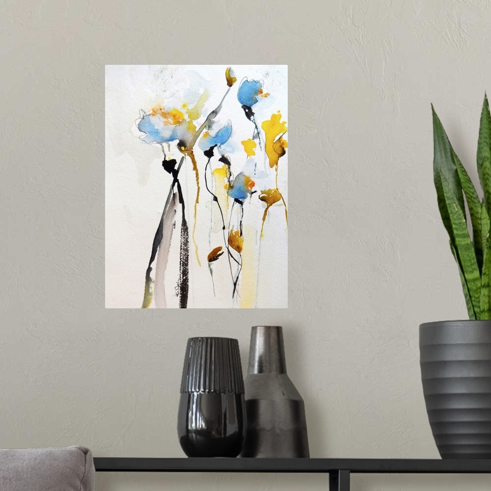 A modern room featuring Contemporary watercolor painting of vibrant yellow and blue flowers.