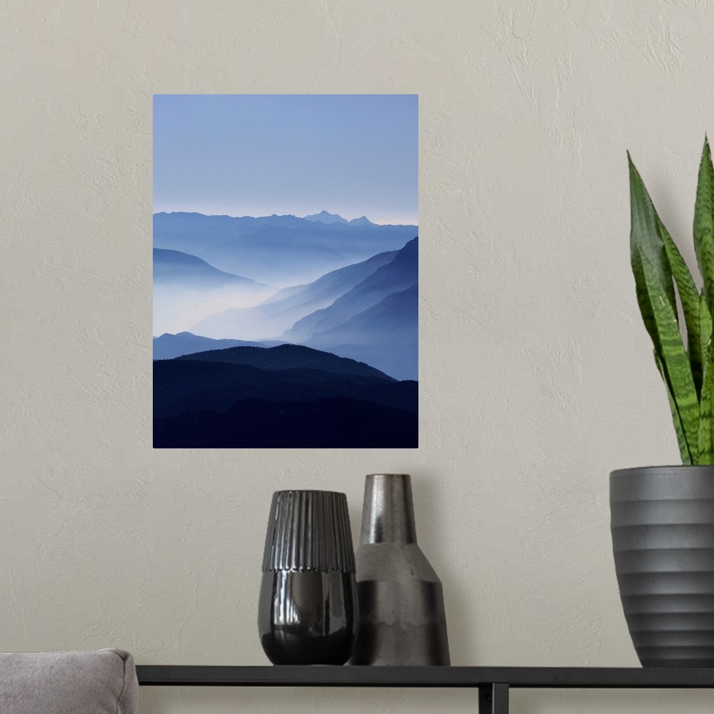 A modern room featuring A photograph of clouds along the blue ridge mountains.