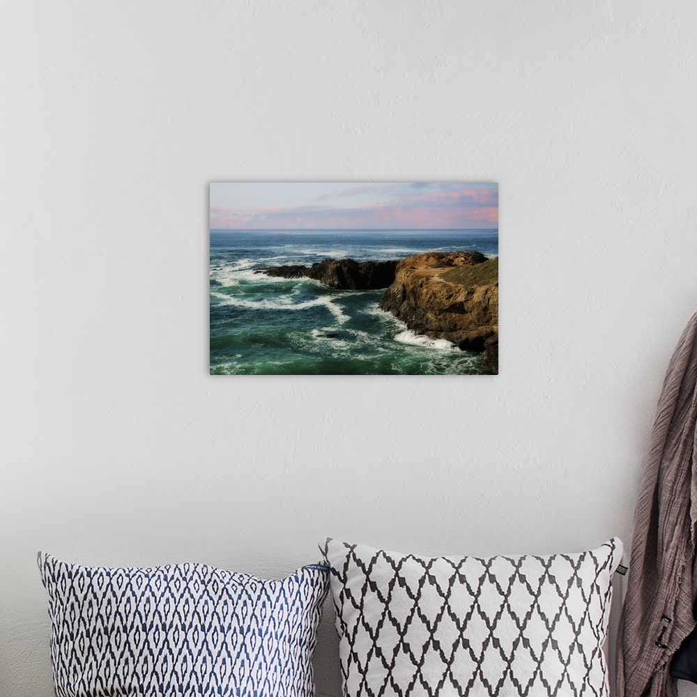 A bohemian room featuring A photograph of a seascape at sunset.