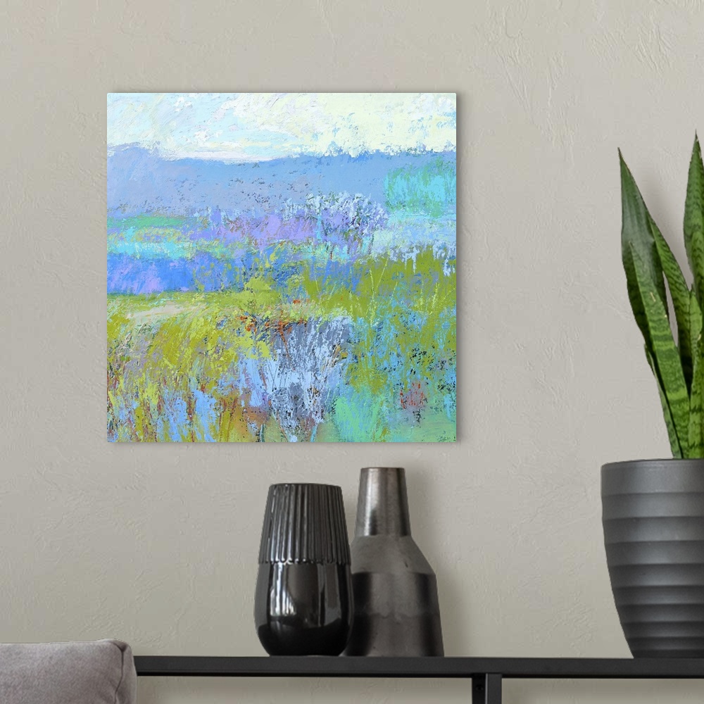 A modern room featuring Contemporary landscape painting in vibrant blue, green, and turquoise shades.