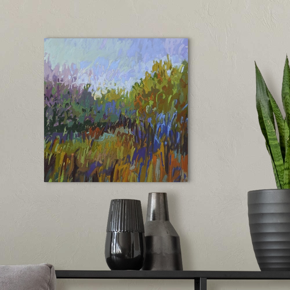 A modern room featuring Semi-abstract painting of a grassy field lined with trees.