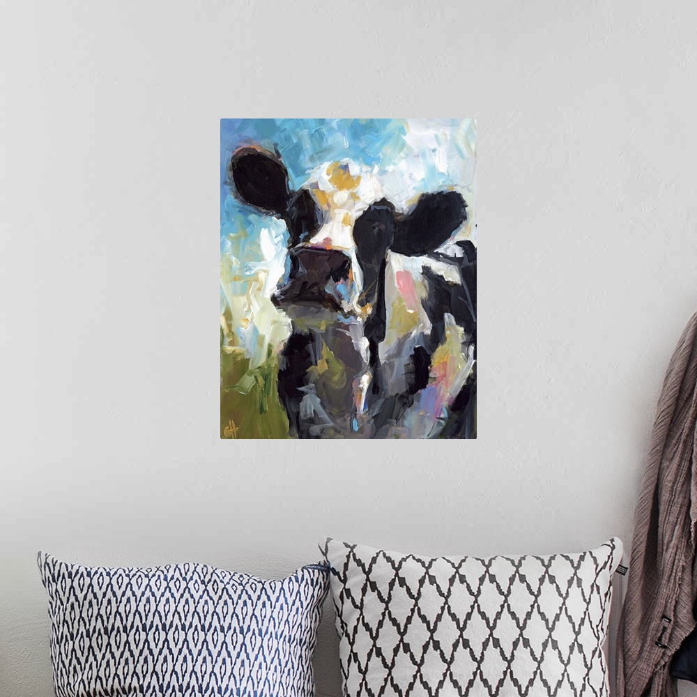 A bohemian room featuring Contemporary portrait of a black and white dairy cow.