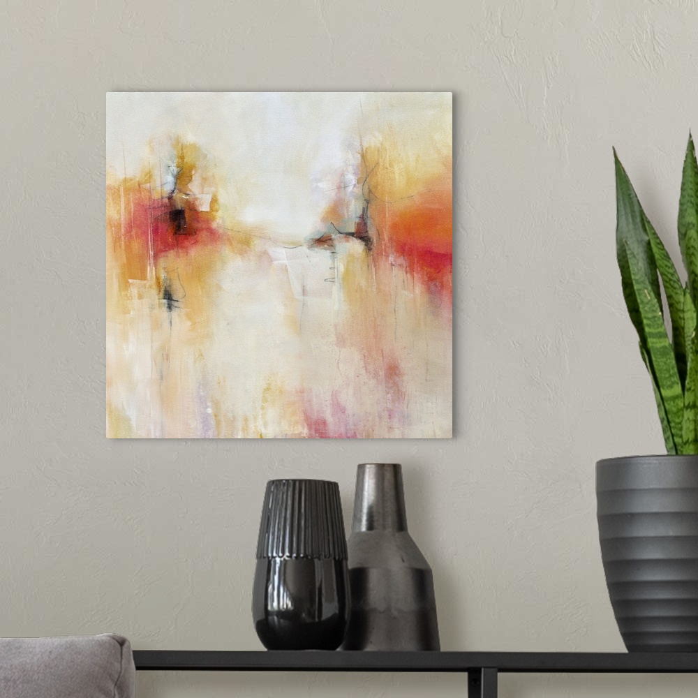 A modern room featuring Abstract artwork in fiery orange and yellow shades.