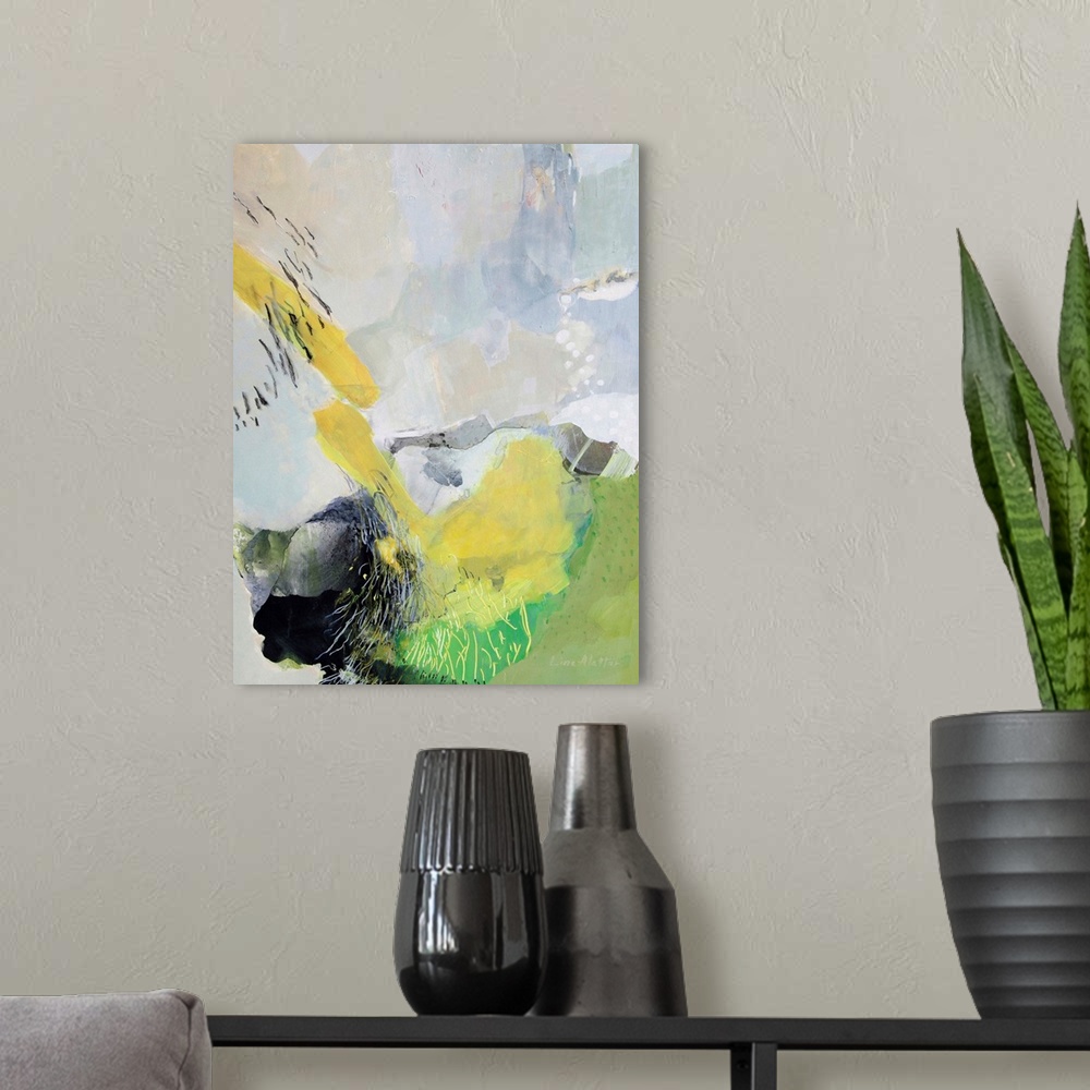 A modern room featuring A vertical abstract painting of shapes in yellow and green with lines.