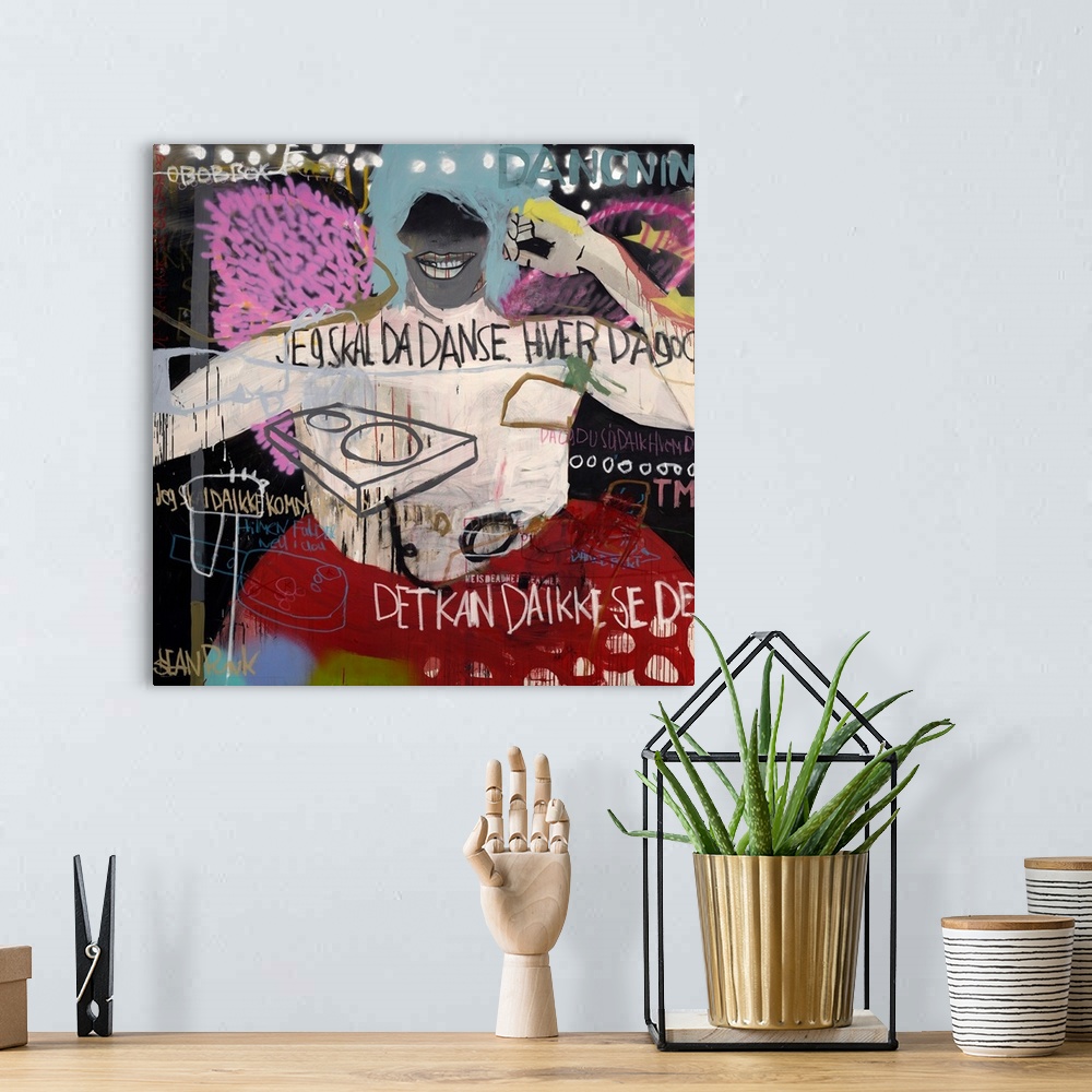 A bohemian room featuring A square abstract painting in a graffiti style.