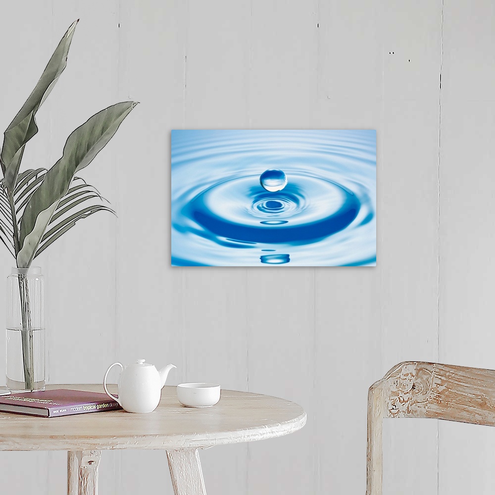 A farmhouse room featuring Horizontal close up photograph of a drop of water with ripples.