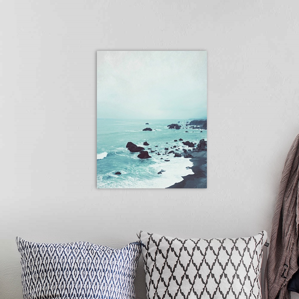 A bohemian room featuring Photography of a peaceful rock beach at dusk.