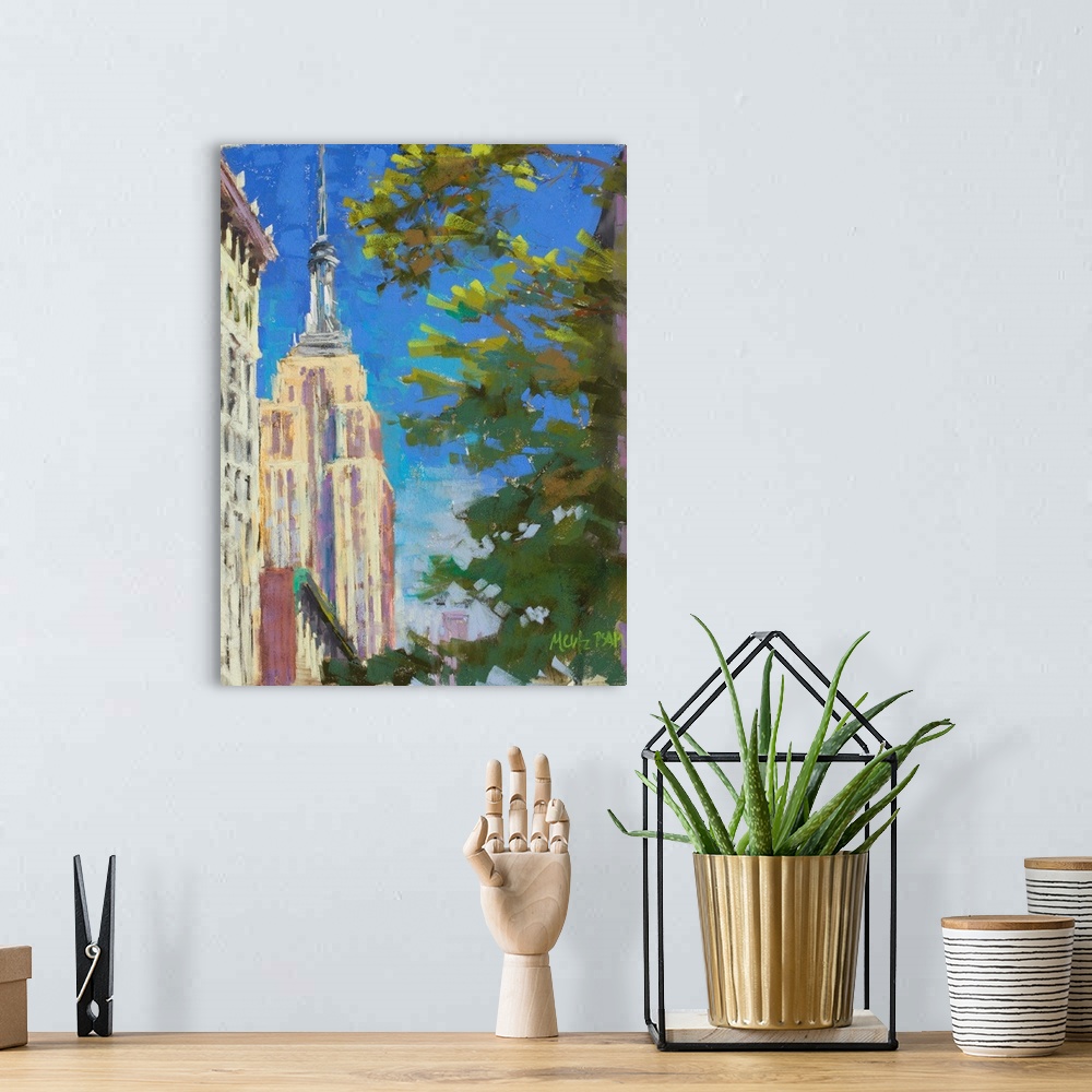 A bohemian room featuring A contemporary painting of the Empire States Building with a tree in the foreground.