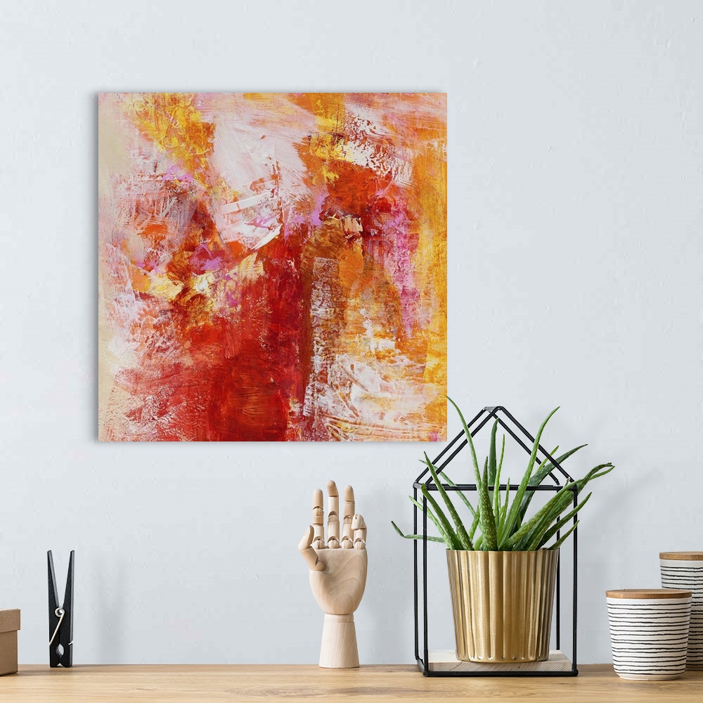 A bohemian room featuring A square abstract painting of textured brush strokes in color tones of yellow, red, orange and pink.
