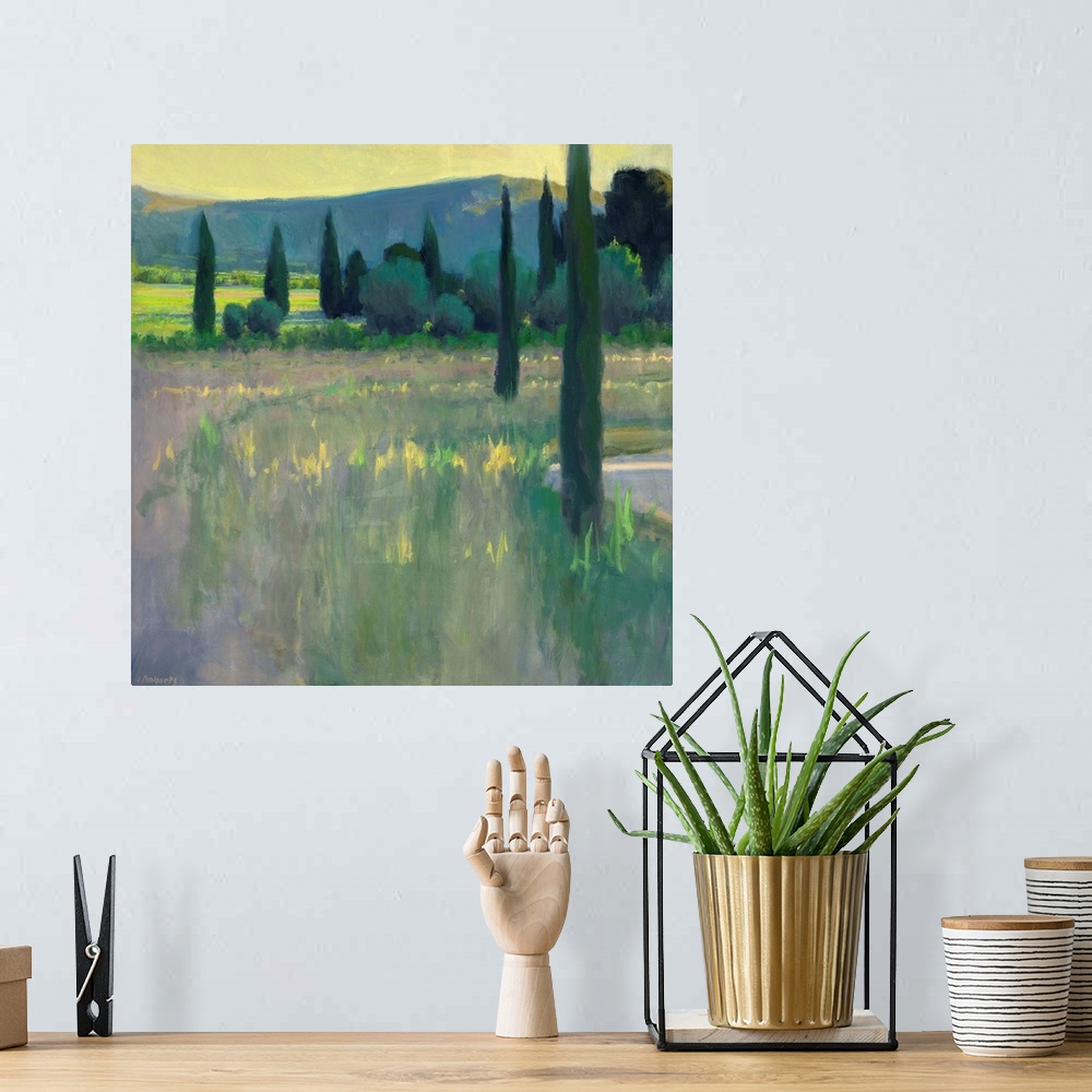 A bohemian room featuring A contemporary landscape painting with tall thin trees.
