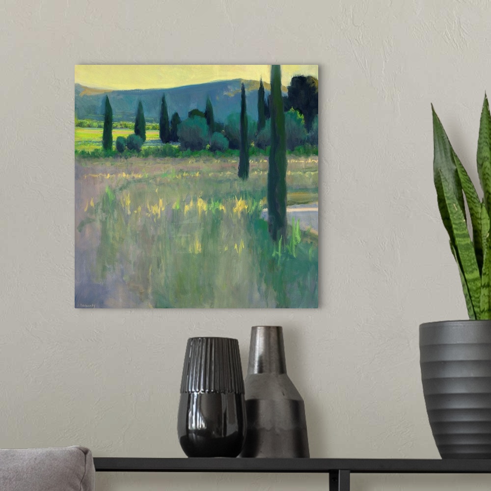 A modern room featuring A contemporary landscape painting with tall thin trees.