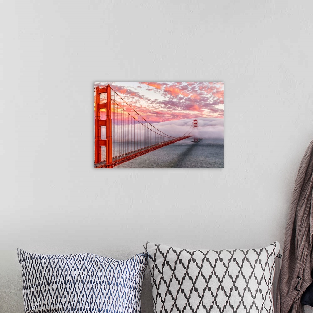 A bohemian room featuring A dynamic photograph of the golden gate bridge disappearing in a thick blanket of clouds.