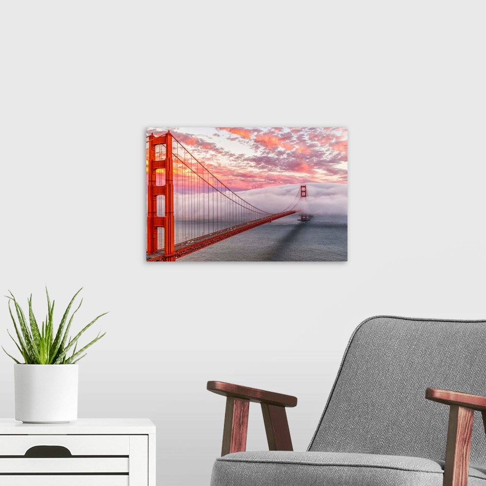 A modern room featuring A dynamic photograph of the golden gate bridge disappearing in a thick blanket of clouds.