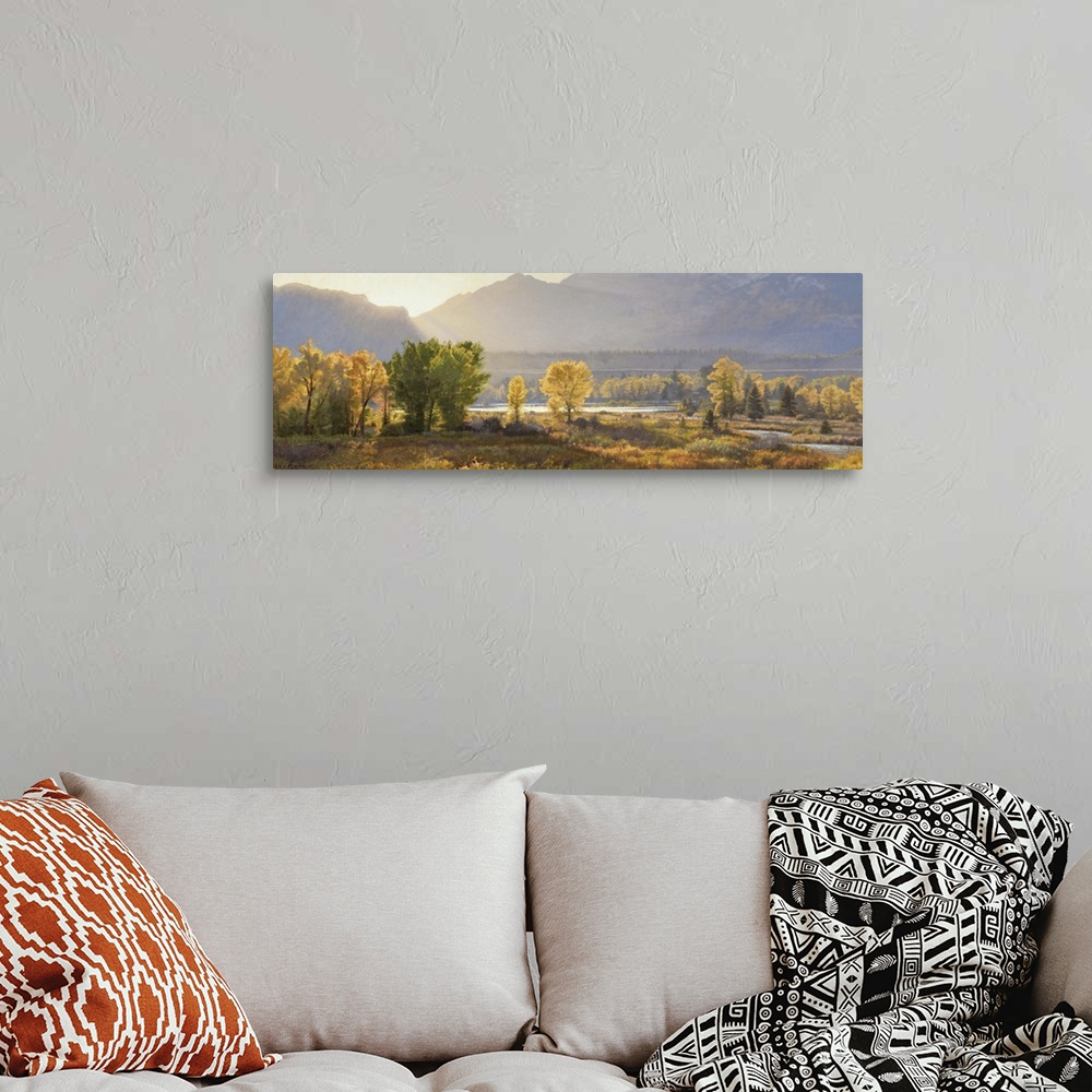 A bohemian room featuring A contemporary landscape painting of a mountain scene at sunset.