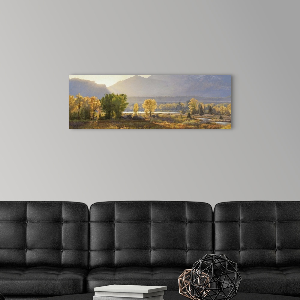 A modern room featuring A contemporary landscape painting of a mountain scene at sunset.
