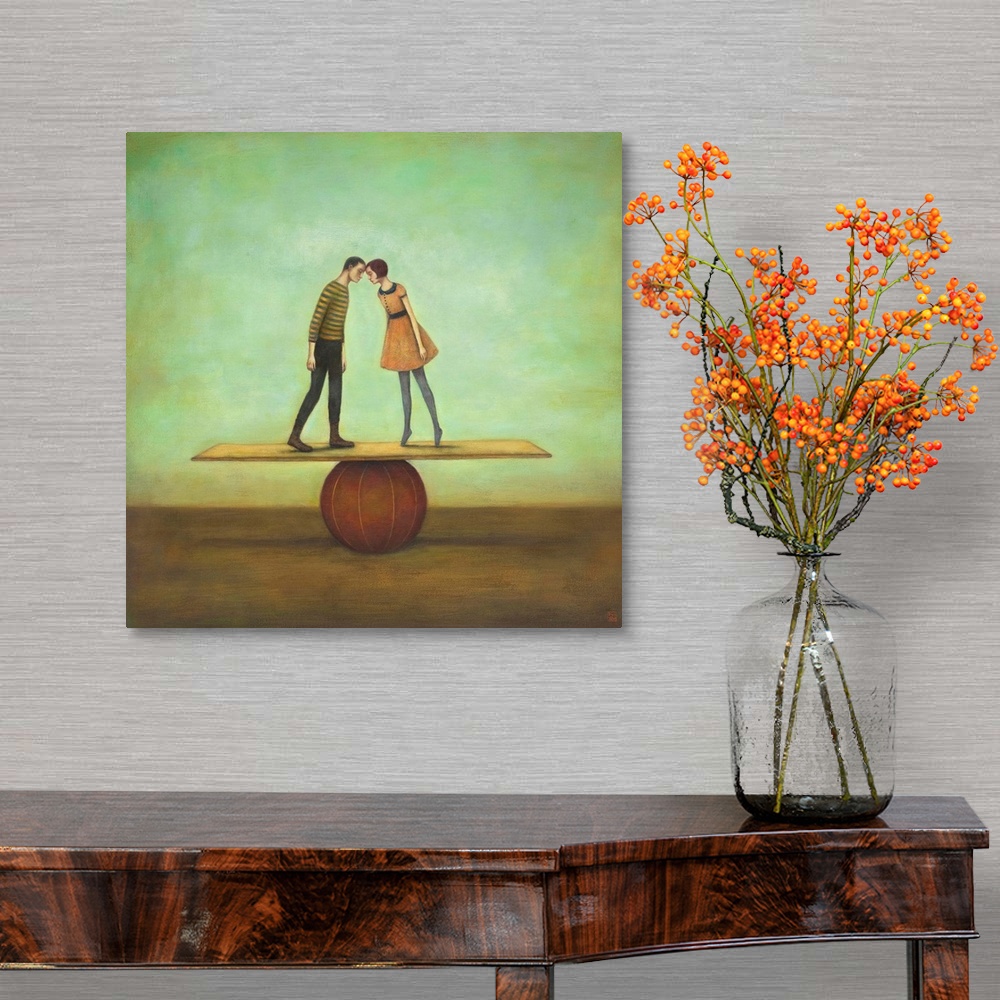 A traditional room featuring Contemporary surreal artwork of a woman and man kissing on a plank balancing on a red ball.