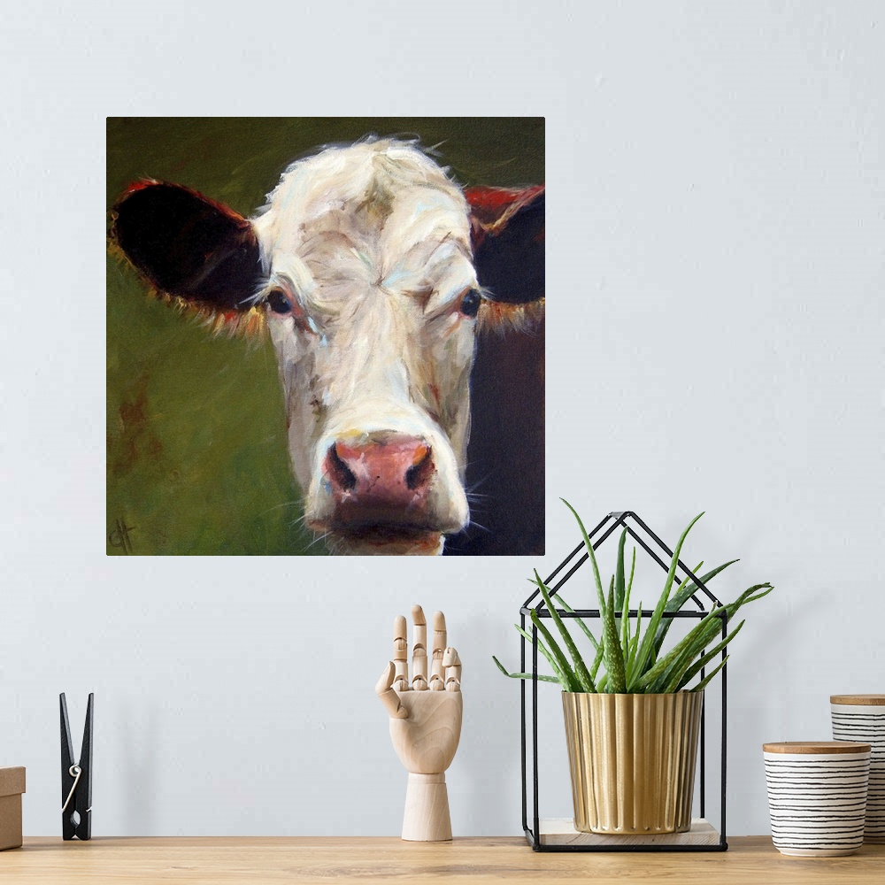 A bohemian room featuring Contemporary portrait of a dairy cow with large ears.