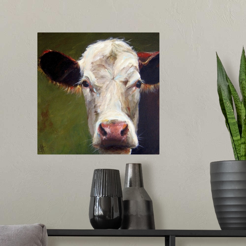 A modern room featuring Contemporary portrait of a dairy cow with large ears.