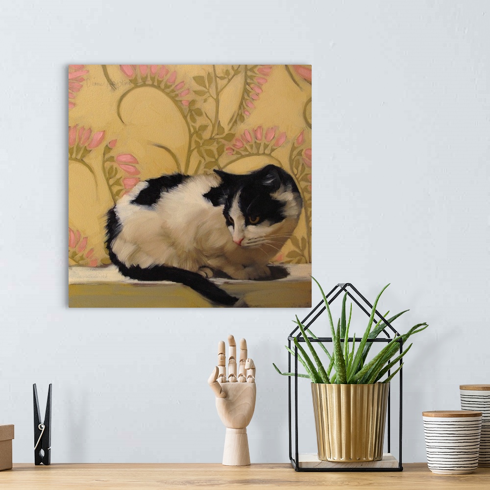 A bohemian room featuring Contemporary painting of a black and white cat lying near a wall with yellow floral wallpaper.