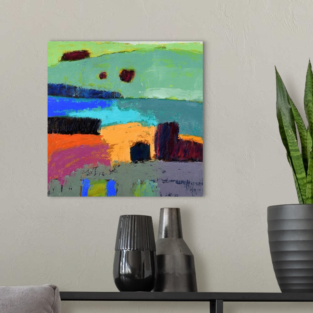 A modern room featuring A square abstract of a landscape of rolling hills painted in vibrant colors.