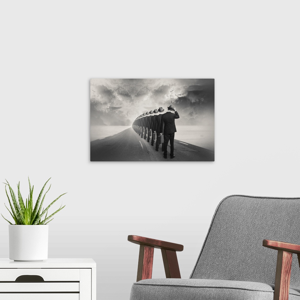 A modern room featuring An abstract art photograph of a man in a suit standing behind a row of hollow suits in a row. Sta...