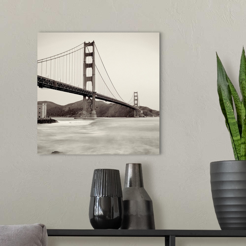 A modern room featuring A black and white photograph of the Golden Gate Bridge in San Francisco.