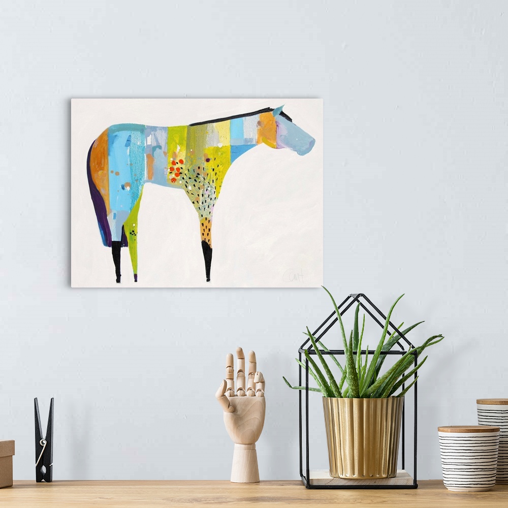 A bohemian room featuring A contemporary painting of a multi-colored horse against a white background.