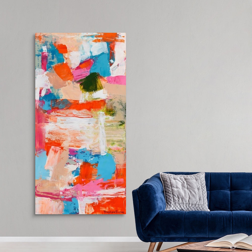 A modern room featuring A contemporary abstract painting of intense shades of of orange, pink, and tan.