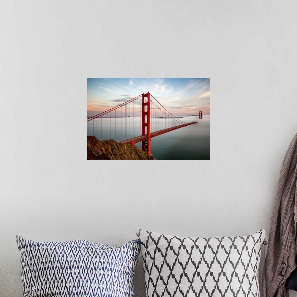 A bohemian room featuring The towers of the Golden Gate bridge in San Francisco, California, half-covered in mist.