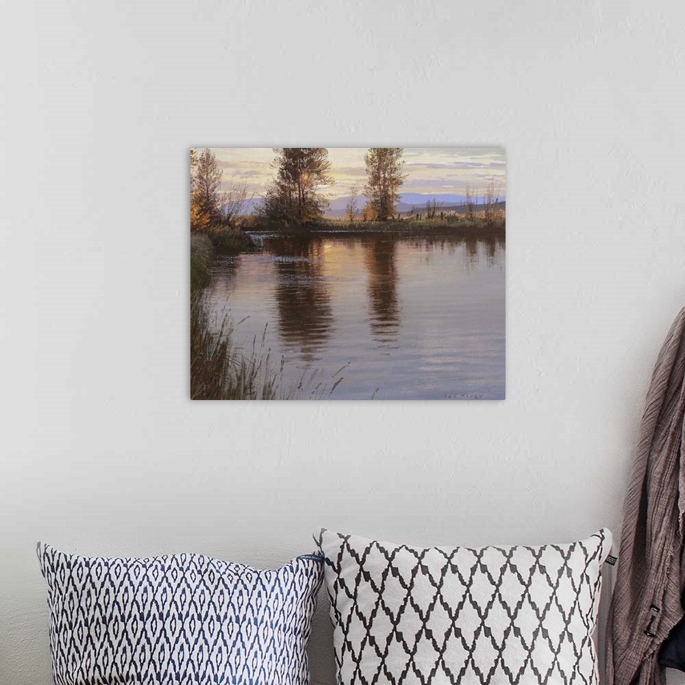 A bohemian room featuring A contemporary landscape painting of a lake at sunset reflecting the surrounding trees