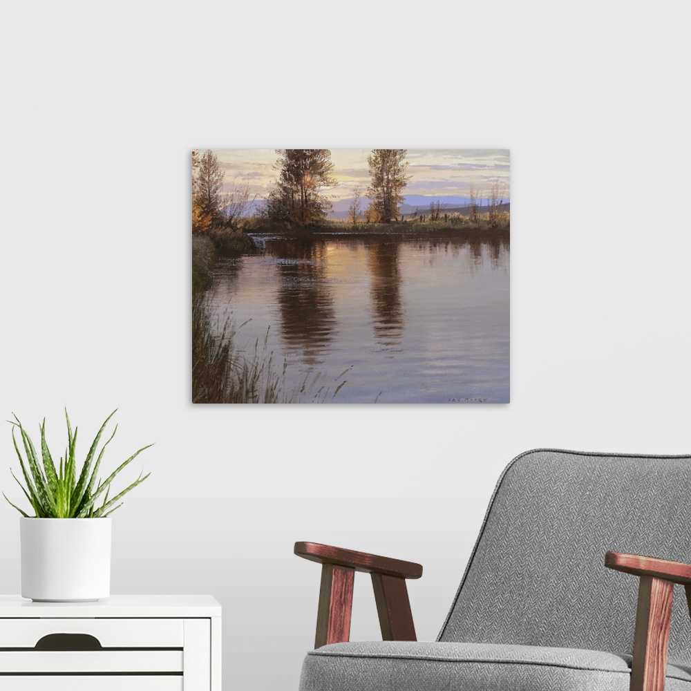 A modern room featuring A contemporary landscape painting of a lake at sunset reflecting the surrounding trees