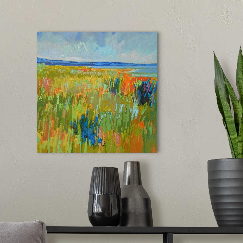 A modern room featuring A contemporary abstract painting using vibrant colors resembling a countryside landscape.
