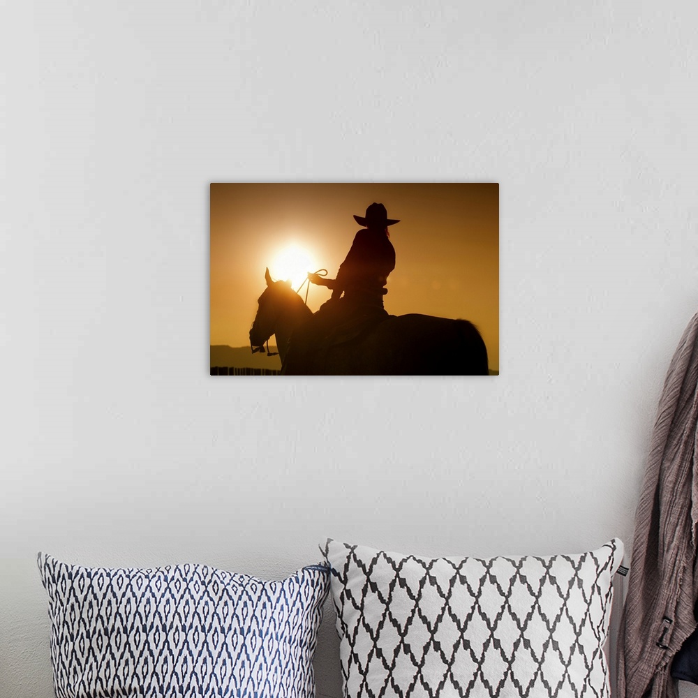 A bohemian room featuring Sunset shot of Cowgirl on Horse