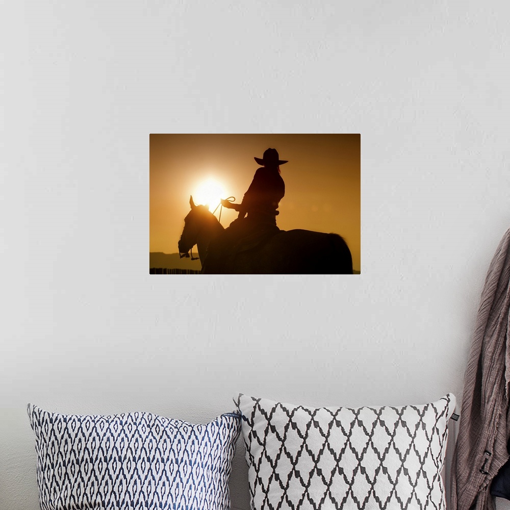 A bohemian room featuring Sunset shot of Cowgirl on Horse