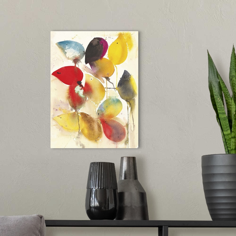 A modern room featuring Contemporary abstract watercolor painting of vibrant colored autumn leaves.