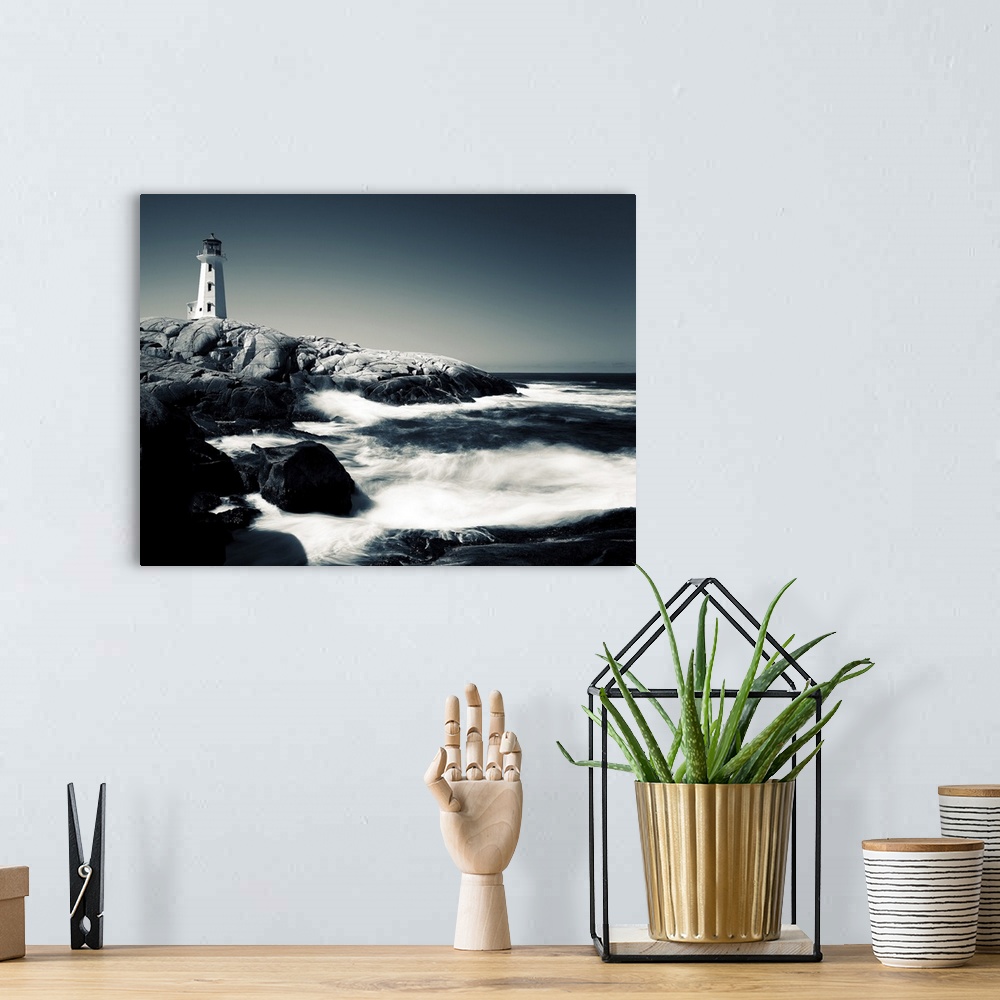 A bohemian room featuring A black and white image of Peggy's Cove Lighthouse in Nova Scotia, Canada.
