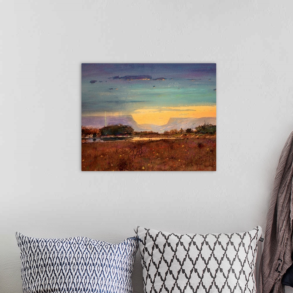 A bohemian room featuring A contemporary painting of a southwestern landscape under a stormy sky.