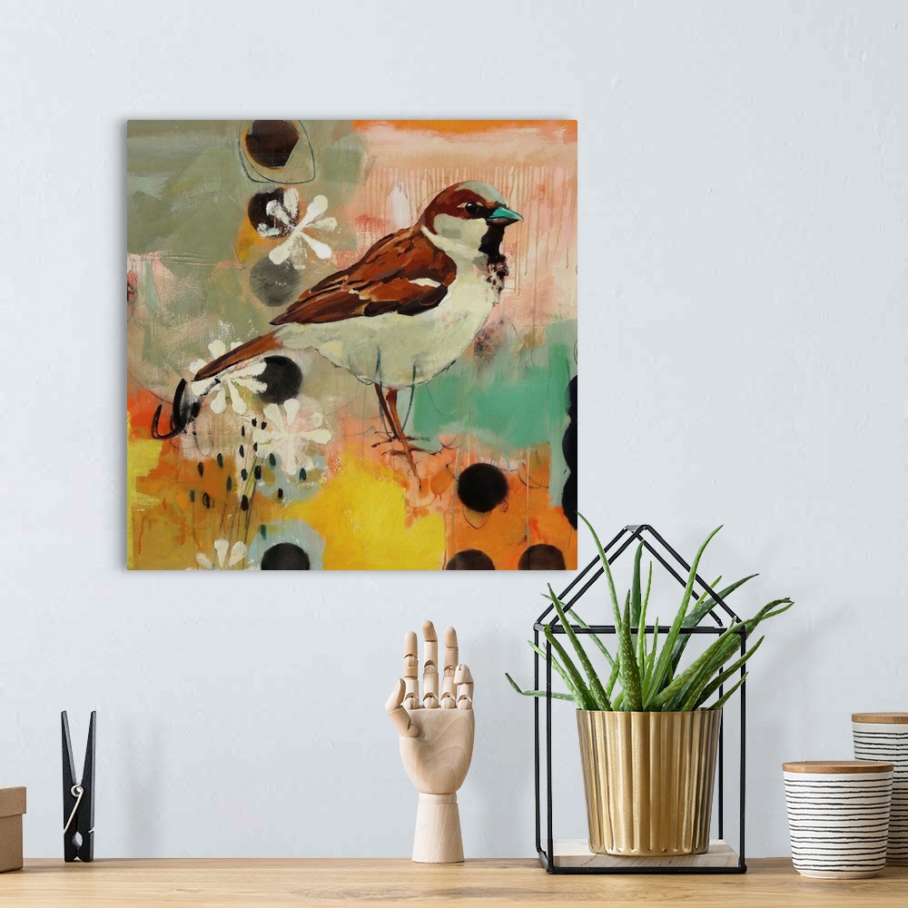 A bohemian room featuring A contemporary painting of a brown and tan bird against a colorful abstract background.
