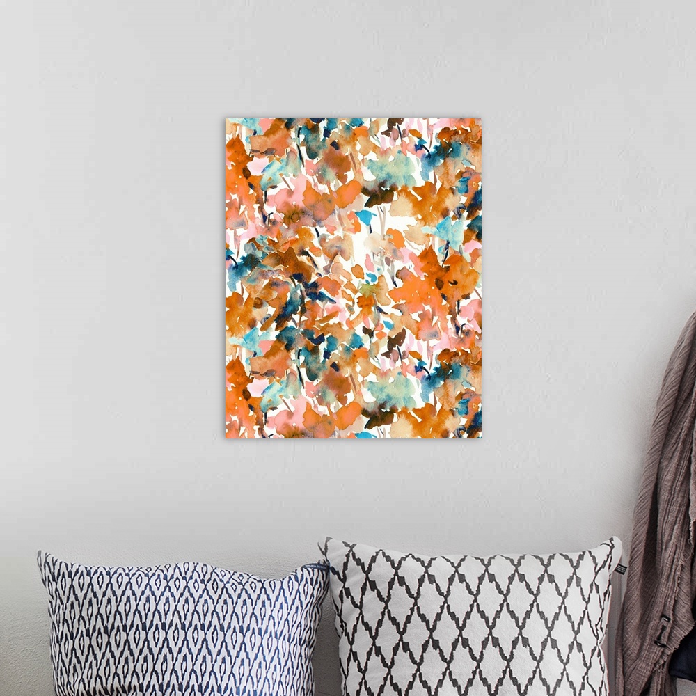 A bohemian room featuring An abstract watercolor painting of branches of leaves in colors of orange and brown.