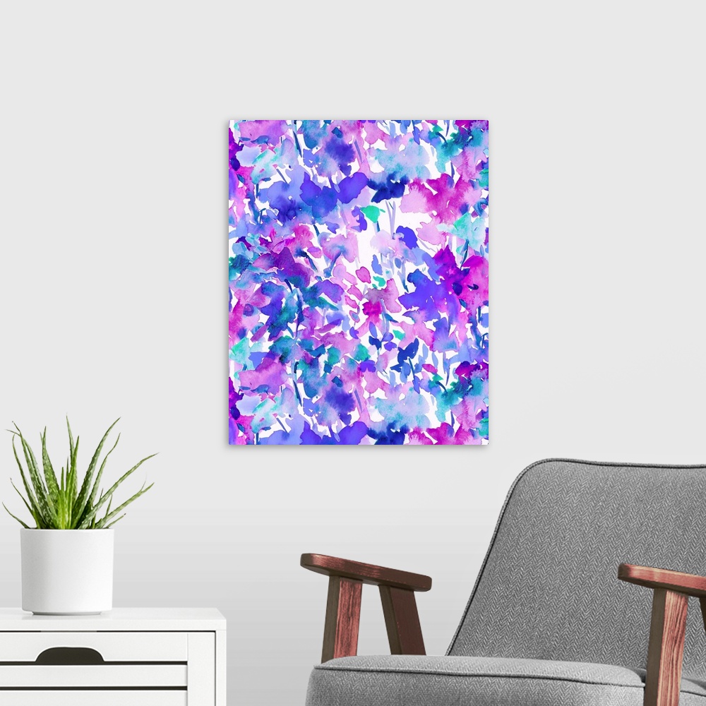 A modern room featuring An abstract watercolor painting of branches of leaves in colors of blue and purple.