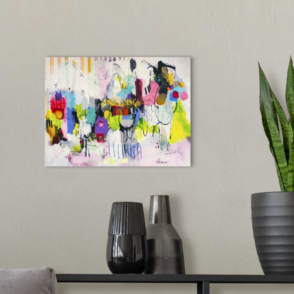A modern room featuring Contemporary abstract painting using bright vibrant neon splashes of color against a soft pink an...
